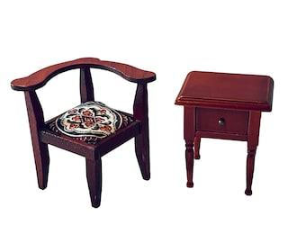 May include: A miniature wooden chair with a patterned cushion and a matching miniature wooden side table with a drawer.
