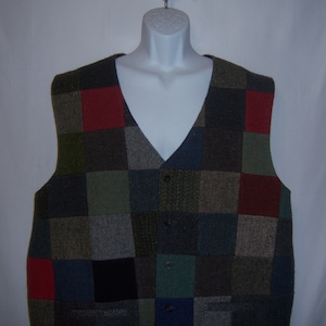 May include: A patchwork vest with a variety of colors and patterns, including red, green, blue, and brown. The vest has a V-neck and a button closure.