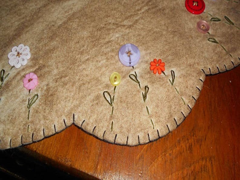 Table mat with button flowers in each scallop measuring about Etsy