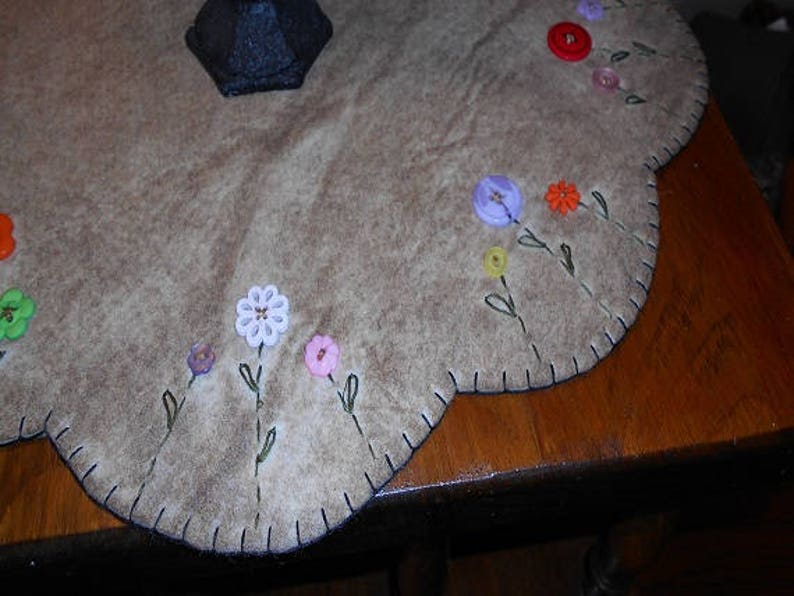 Table mat with button flowers in each scallop measuring about Etsy