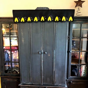 Mantle/shelf scarf with bees and beeskeps on a black  background measuring 14x36 inches