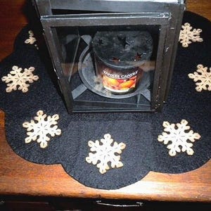 Primitive snowflake candle mat with coffee dye snowflakes(shown) or off white snowflakes on a black background. image 3