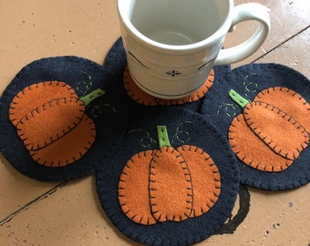 Pumpkin coasters set of 4 with a black background