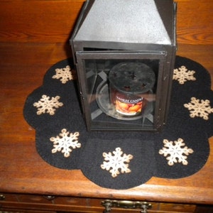 Primitive snowflake candle mat with coffee dye snowflakes(shown) or off white snowflakes on a black background. image 2