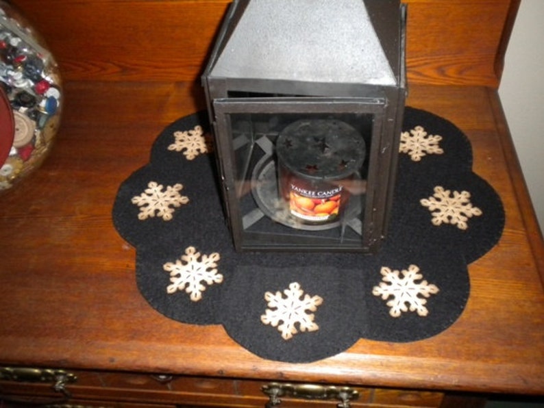 Primitive snowflake candle mat with coffee dye snowflakes(shown) or off white snowflakes on a black background. image 2