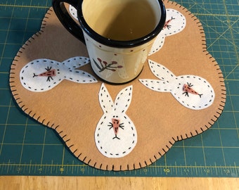 Bunny candle mat tan background with off white bunnies