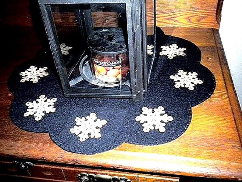 Primitive snowflake candle mat with coffee dye snowflakes(shown) or off white snowflakes on a black background. image 1
