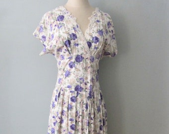 100% Rayon Cottage Core Fit and Flare Sun Dress in purple rose floral with Pockets made by The Originals USA with covered buttons.