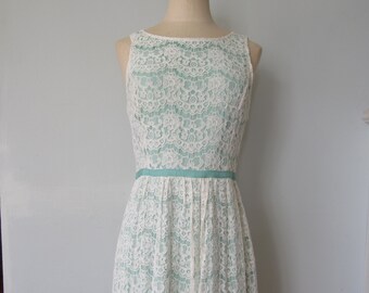 White Cotton Lace Fit and Flare Dress by Elle size Small. Sleeveless lace dress with mint green trim. Fast shipping.