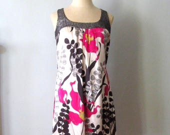 Silk floral Dress by Trina Turk.  Sleeveless with tiny sequin boarder at neck. .