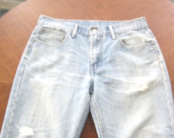 Levis 33 inch waist by 33 inseam pale blue denium with perfectly worn knees.