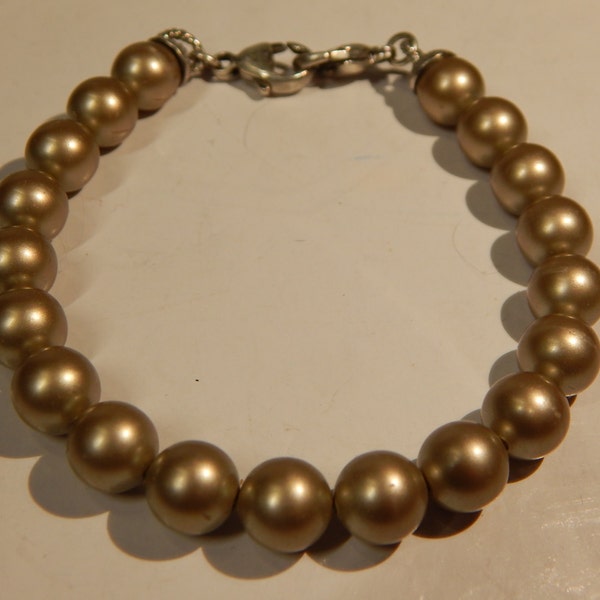 Bracelet, Medic Alert, used, too large, fits size 8 wrist, black pearls. crab claws on both ends