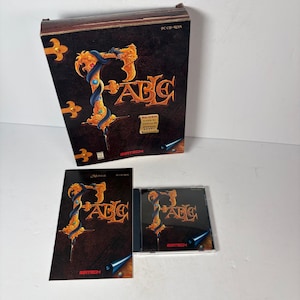 May include: A Fable PC CD-ROM game set including a large rectangular cardboard box, a manual, and a jewel case. The packaging features a dark background with a large stylized letter F, a blue serpent, and the text Fable and Sir-Tech.