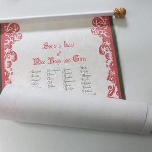 May include: A scroll featuring "Santa's List of Nice Boys and Girls" in red script. The scroll has a white background with a decorative red border and gold-colored finials. The list includes names.