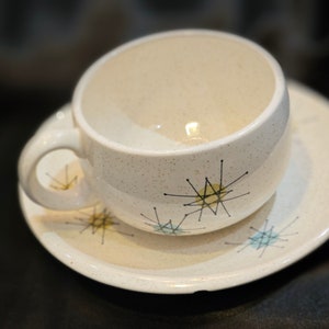 1950s Vintage Franciscan STARBURST Set / Cup and Saucer, each with a shall chip