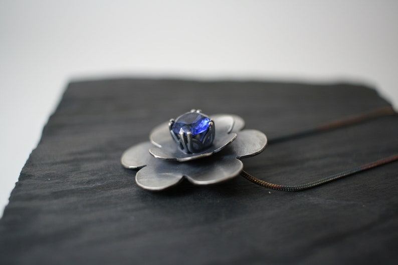 September Birthstone Oxidized sterling silver flower pendant with lab created sapphire faceted stone