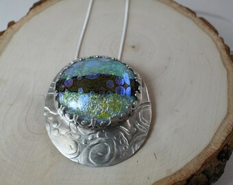 Dichroic glass cabochon set in textured sterling silver pendant necklace