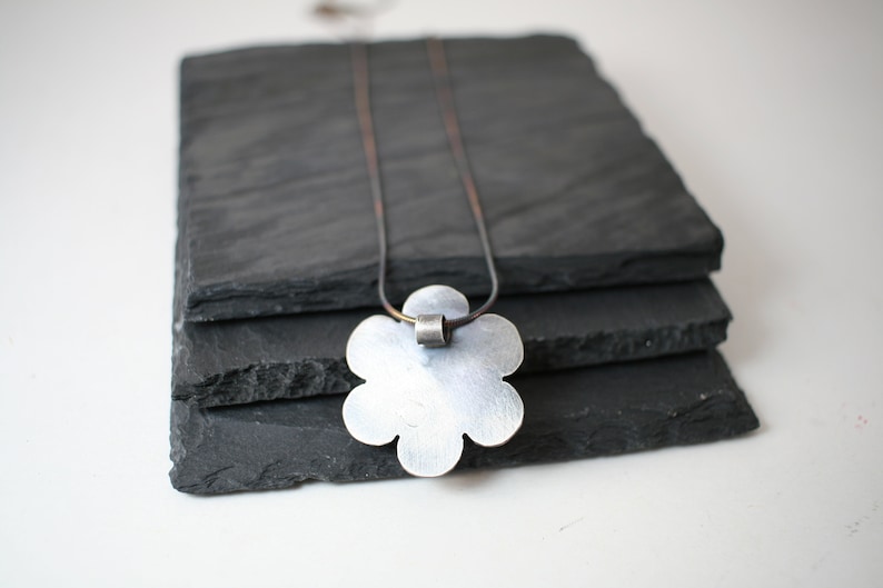 September Birthstone Oxidized sterling silver flower pendant with lab created sapphire faceted stone