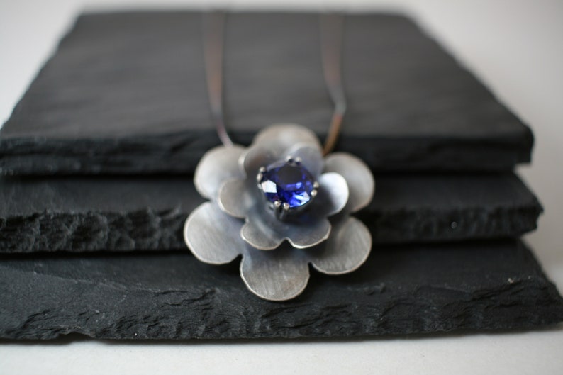 September Birthstone Oxidized sterling silver flower pendant with lab created sapphire faceted stone