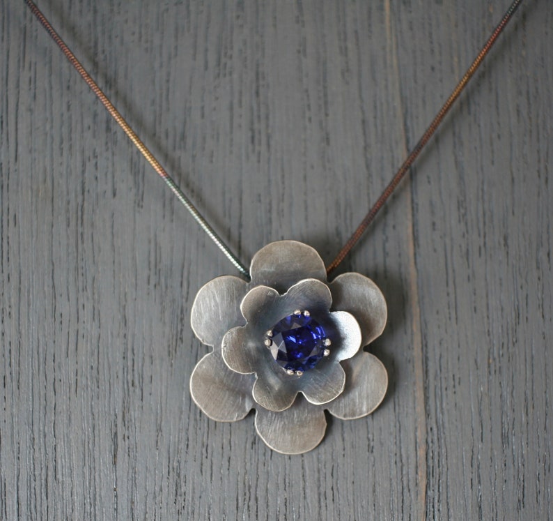 September Birthstone Oxidized sterling silver flower pendant with lab created sapphire faceted stone