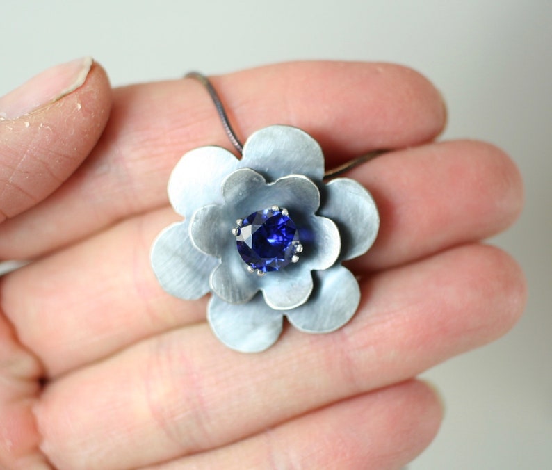 September Birthstone Oxidized sterling silver flower pendant with lab created sapphire faceted stone