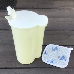 May include: A set of three ceramic mugs with a speckled, matte finish. The mugs are in shades of cream, light gray, and dark gray. Each mug has a simple, minimalist design and a rounded handle. The mugs are likely for coffee or tea.