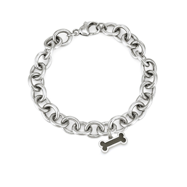 This photo shows the sterling silver cable chain cremation bracelet with the dog bone ashes charm. The chain on this bracelet in thick and is a statement piece.