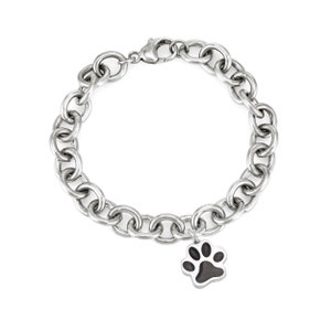 This photo shows the sterling silver cable chain cremation bracelet with the paw print ashes charm. The chain on this bracelet in thick and is a statement piece.