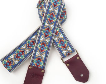 The Lefty Guitar Strap - Southwest style Native embroidered design in yellow, orange, red, white on  blue background with leather ends