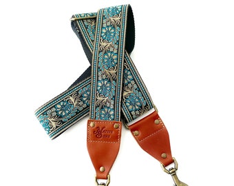 The Luna Guitar Strap Style Bag Strap - Blue and Gold Floral on a Black Background with black Nylon or Natural Hemp made with Leather