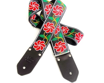 The Ella Guitar Strap de Native Sons - Flor de molinete rojo brillante con correa de guitarra verde y amarilla y negra de cáñamo o nylon de 2 pulgadas de ancho