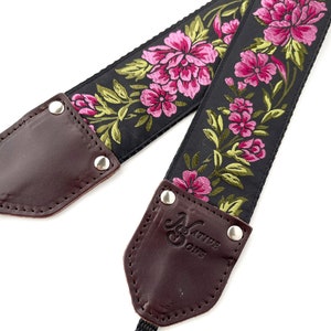 The Odel Camera Strap Fuchsia Pink and green floral on a black background, & leather image 2