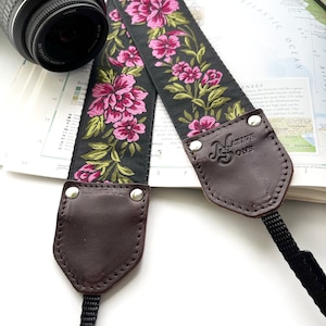 The Odel Camera Strap Fuchsia Pink and green floral on a black background, & leather image 3