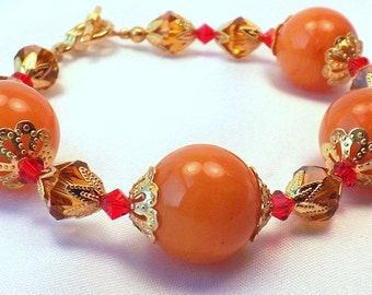 かわいい秋のハイライト、赤とオレンジのクリスタル付きルーサイトブレスレット