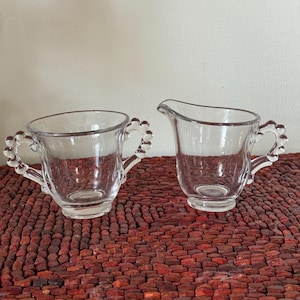 Glass creamer and sugar bowl