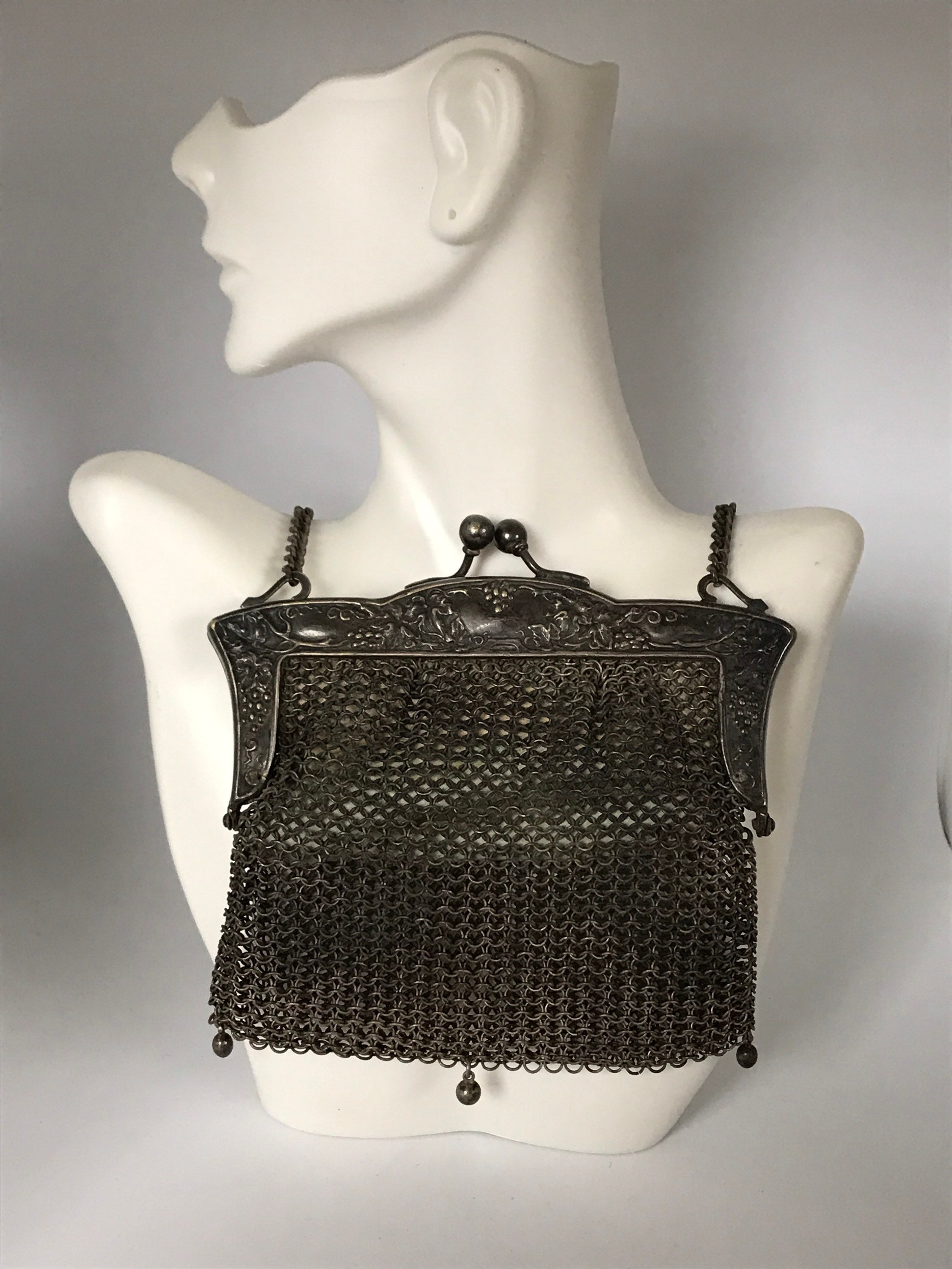 A large example of an antique German silver evening purse, set with a  purpose set coin storage compa
