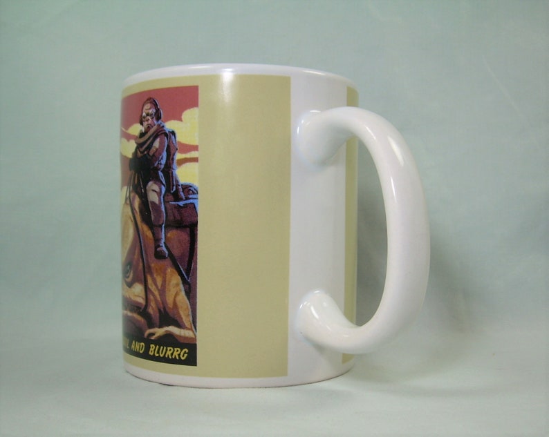 Puede incluir: Taza de cer&aacute;mica blanca con asa. La taza tiene una imagen colorida de una persona montando una criatura con el texto "and BLURRG" en la parte inferior.