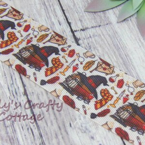 May include: Cream-colored ribbon featuring a repeating pattern of a wizard's hat, scarf, potion bottles, keys, and other magical elements. The ribbon has a textured appearance and the text "Tilly's Crafty Cottage".