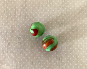 2 vintage opaque oxblood, green swirl marbles, vintage marbles, antique marbles, old marbles, marbles vintage, oxblood marbles, green marble