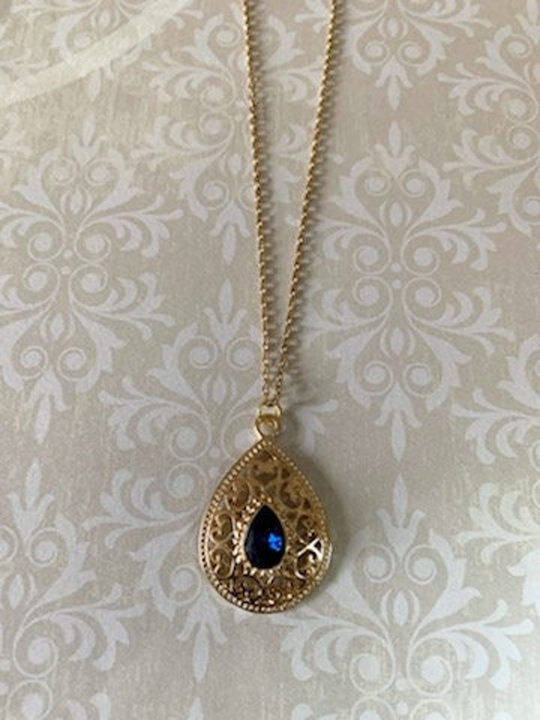 Royal blue and gold best sale necklace