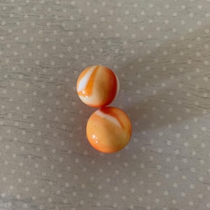 2 opaque white w/red orange yellow patch, vintage marbles, vintage marbles, antique marbles, old marbles, marbles vintage, orange marbles,