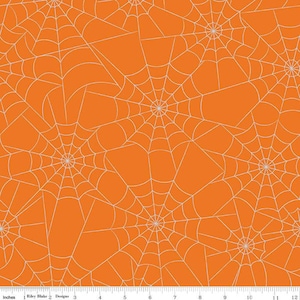 May include: Orange fabric with a white spiderweb pattern. The spiderwebs are overlapping and create a repeating pattern.