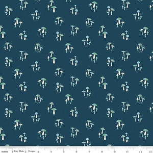 May include: A dark blue fabric with a repeating pattern of white and green mushrooms. The mushrooms are in various sizes and shapes.