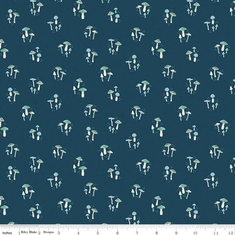 May include: A dark blue fabric with a repeating pattern of white and green mushrooms. The mushrooms are in various sizes and shapes.