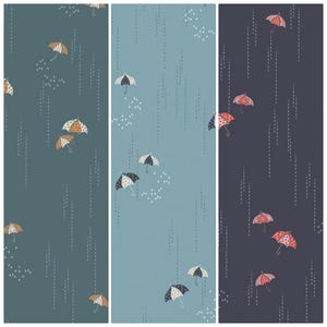 May include: Three different fabric patterns featuring colorful umbrellas on a background of rain. The first pattern is teal with orange and white umbrellas. The second pattern is light blue with white and black umbrellas. The third pattern is dark blue with pink and white umbrellas.