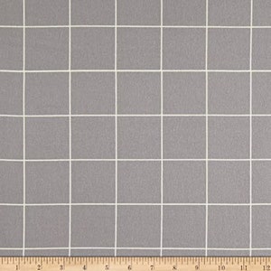 Puede incluir: Tela gris con un patrón de cuadrícula blanca. La tela es texturizada y tiene un brillo sutil.