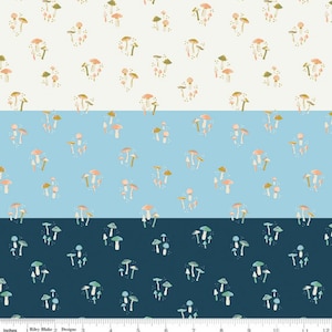 May include: A white, light blue, and dark blue fabric with a repeating pattern of colourful mushrooms. The fabric is ideal for quilting, sewing, and crafting.
