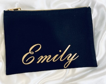 May include: Black canvas zippered pouch with a gold zipper and the name "Emily" written in gold cursive lettering.
