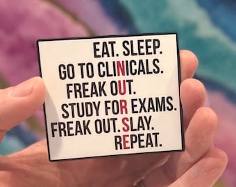 May include: White sticker with black text that reads "EAT. SLEEP. GO TO CLINICALS. FREAK OUT. STUDY FOR EXAMS. FREAK OUT. SLAY. REPEAT."
