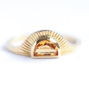 sunset orange sapphire ring with half moon orange sapphire bohemian band